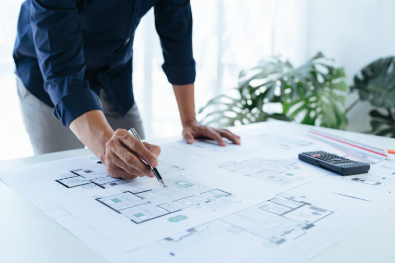 Close-up, architects team are brainstorming, designing and drawing the structure of the building